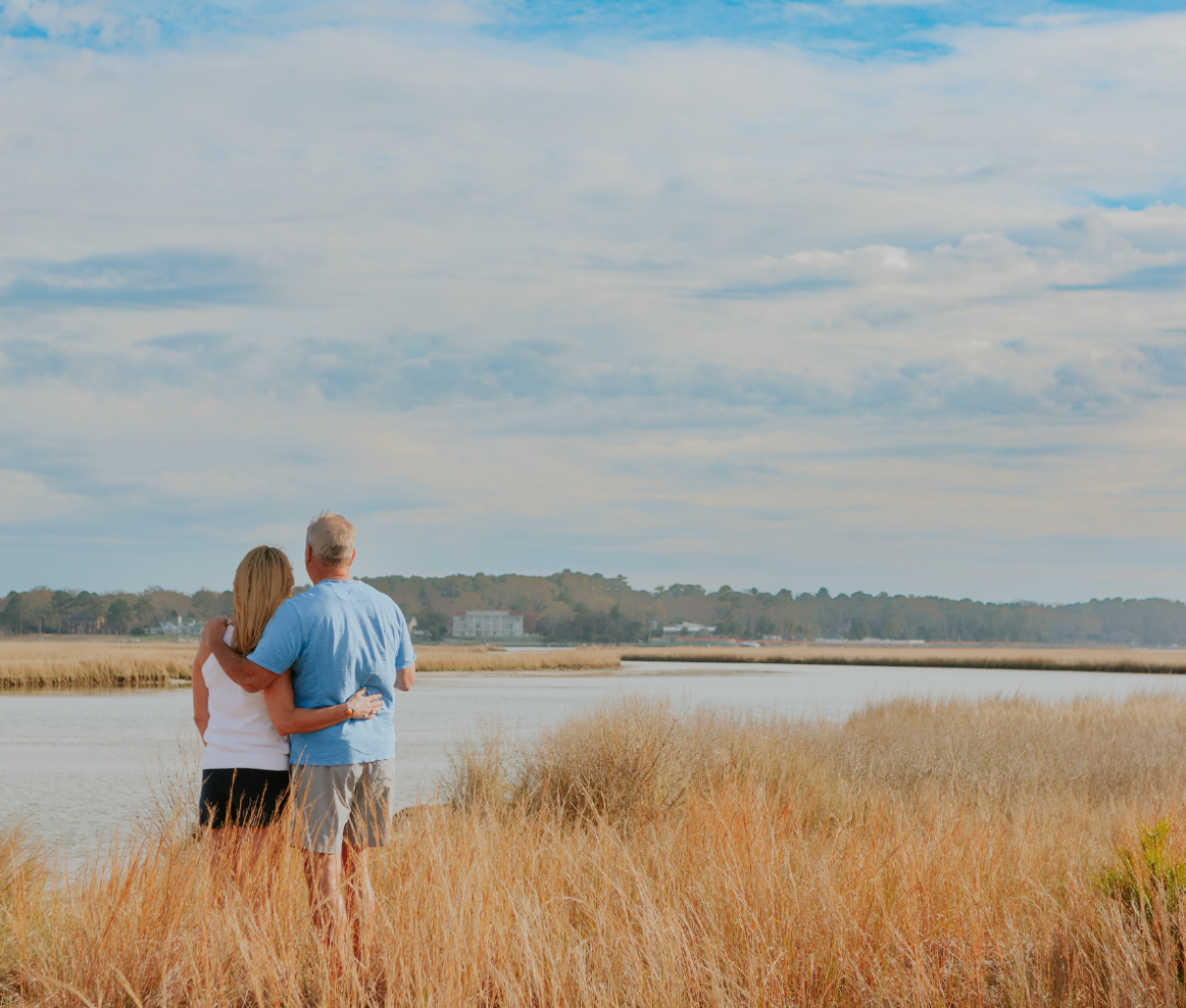 A couple cuddling at Chesapeake Bay, Virginia Beach, USA.